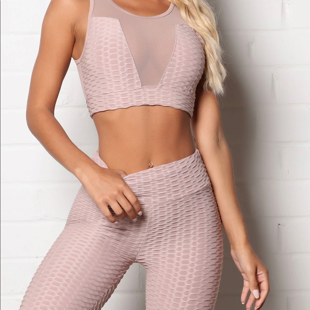 Textured sports bra, mesh detailing on front and back.